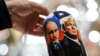 RUSSIA -- A vendor shows a traditional Russian wooden nesting doll, Matryoshka doll, depicting Russia's President Vladimir Putin and US President and Republican presidential nominee Donald Trump at a gift shop in central Moscow on November 3, 2020. (Photo