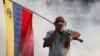 Манифестант, член партии "Народная воля", которой руководит Леопольдо Лопес, на акции в Каракасе. Протесты в Венесуэле продолжаются несмотря на пандемию. Сентябрь 2020 года