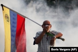 Венесуела – опонент Ніколаса Мадуро під час антиурядових акцій протесту в Каракасі. 30 квітня 2019 року