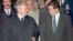 Serbian President Slobodan Milosevic (left) is greeted by U.S. Assistant Secretary of State Richard Holbrooke after arriving at Wright-Patterson Air Force Base near Dayton, Ohio, on October 31, 1995.