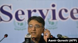 Pakistani Finance Minister Asad Umar speaks at a news conference in Islamabad on October 25.