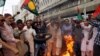 Supporters of Pakistan People's Party (PPP) burn tires and chant slogans to condemn the arrest of former president Asif Ali Zardari by National Accountability Court (NAB) in Islamabad on June 10.