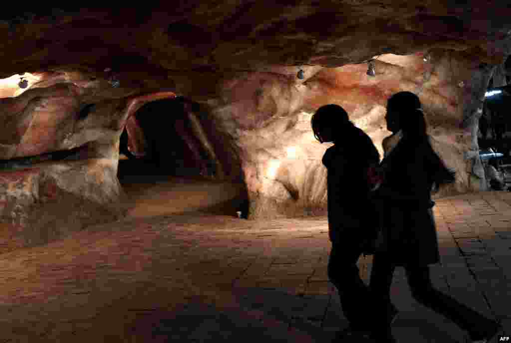 Schoolgirls explore a tourist area inside the Khewra mine.&nbsp;