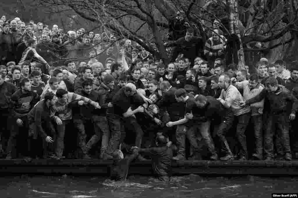 The Up&#39;ards and Down&#39;ards grapple for the ball during the annual Royal Shrovetide Football Match in Ashbourne, in Derbyshire, England. Sports -- First Prize, Singles. (Oliver Scarff, AFP)&nbsp;