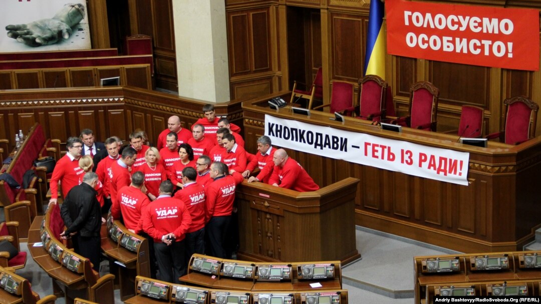 Ukrainian opposition politicians have occupied the parliament's podium for more than two weeks. 