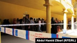 People line up to vote in regional parliamentary elections in Iraq's autonomous Kurdish region on September 21. 