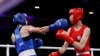 Svetlana Kamenova Staneva of Bulgaria (left) strikes Taiwan's Lin Yu-ting on August 4 in Paris.