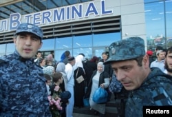 Law enforcement officers ensure security at the airport in Makhachkala on October 31.