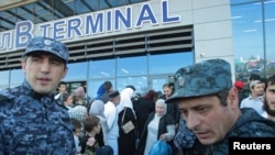 Law enforcement officers maintain a heavy presence at the airport in Makhachkala, Daghestan, on October 31, days after a mob of some 1,000 people shouting anti-Semitic slogans stormed the facility looking to block entry to "refugees from Israel."
