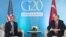 U.S. President Barack Obama (left) speaks as Turkish President Recep Tayyip Erdogan looks on during a meeting on the sidelines of the G20 summit in Antalya on November 15.