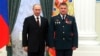 General Lieutenant Valery Asapov (right), then a colonel, stands next to Russian President Vladimir Putin after being decorated by him in a ceremony at the Kremlin in Moscow in February 2013.