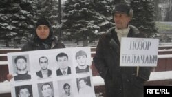 Gulnara Rustamova, co-chairwoman of the Mothers of Daghestan for Human Rights -- seen here during a protest over disappearances -- was among the women at whom "Komsomolskaya pravda" pointed a very public finger.