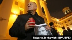 Mikalay Statkevich attends a rally to commemorate victims of Stalin's political repressions outside KGB headquarters in Minsk on October 29.