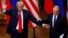 U.S. President Donald Trump (left) and Russian President Vladimir Putin react at the end of their joint news conference after their summit in Helsinki on July 16.