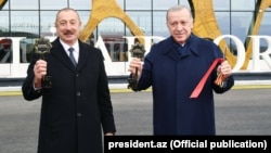 Azerbaijani President Ilham Aliyev and his Turkish counterpart, Recep Tayyip Erdogan, at the opening of Fuzili airport on October 26. 