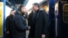 Spanish Prime Minister Pedro Sanchez (right) is greeted by Ukrainian officials upon his arrival in Kyiv on February 23. 