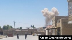A cloud of smoke is seen after an explosion in Kandahar on May 22.