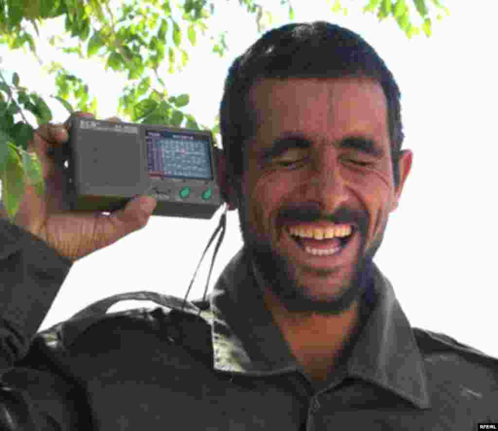 A radio listener in Afghanistan. Radio Free Afghanistan is the most popular radio station in the country.