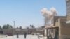 A cloud of smoke is seen after an explosion in Kandahar on May 22.