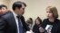 Kazakhstan - Nur-Sultan. Journalist Svetlana Glushkova (right) and lawyer Bauyrzhan Azanov in court. Nur-Sultan. 1Apr2019