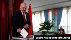 Belarusian President Alyaksandr Lukashenka casts his vote at a polling station in the parliamentary elections in Minsk in November 2019.