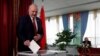 Belarusian President Alyaksandr Lukashenka casts his vote at a polling station in the parliamentary elections in Minsk in November 2019.