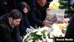 Family and friends at the funeral of Iranian-Canadian environmentalist Kavous Seyed-Emami. 