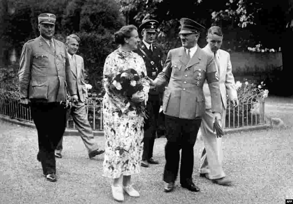 German Chancellor Adolf Hitler, a devotee of Wagner&#39;s music and writings, with the late composer&#39;s daughter-in-law, Winifred Wagner, and her two sons, Wolfgang and Wieland, in Bayreuth, Germany, in 1937