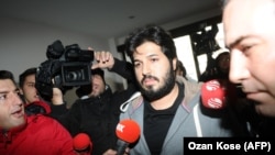 Detained Turkish-Iranian gold trader Reza Zarrab is surrounded by journalists in Istanbul in December 2013.