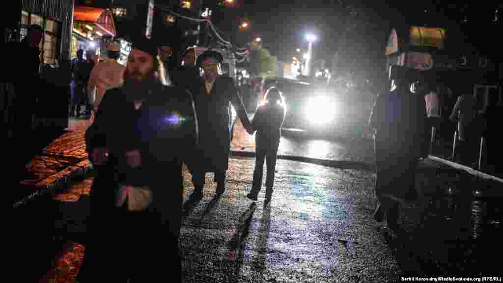 After the prayers Hasidic Jews take a stroll through the streets of Uman.