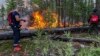 Firefighters battle a wildfire in Yakutia on August 3.