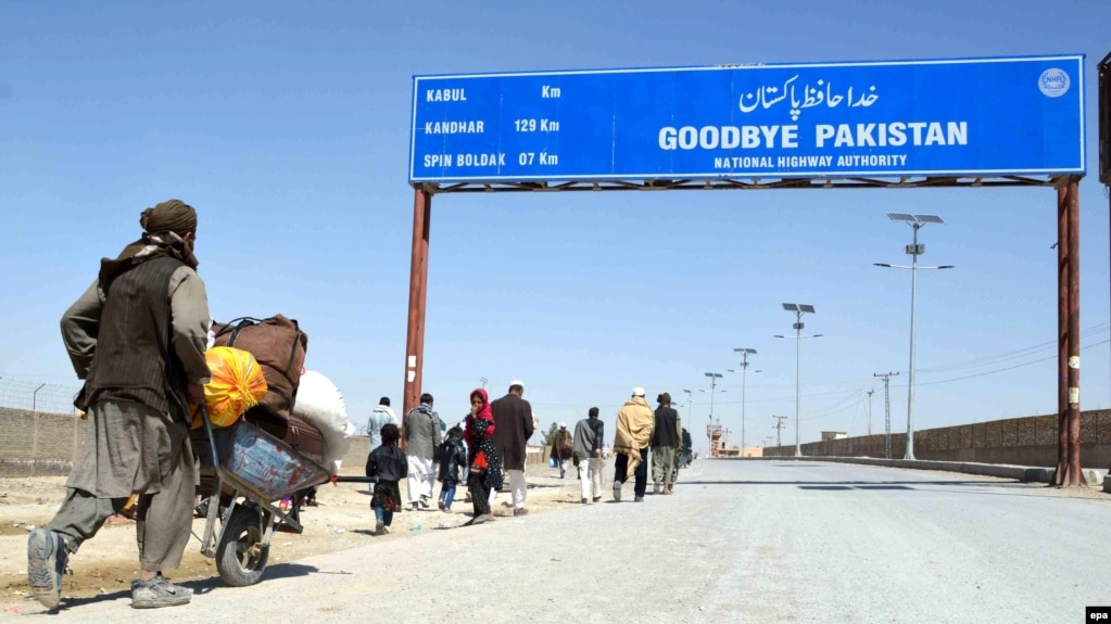 People cross into Afghanistan at the Pakistani-Afghan border in Chaman.