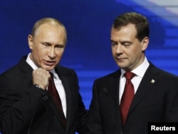 Russian President Dmitry Medvedev (right) and then Prime Minister Vladimir Putin at the United Russia party congress in Moscow in 2011.