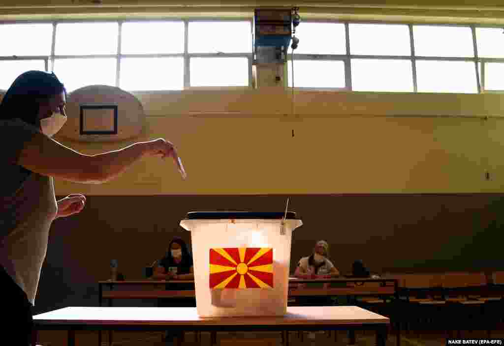A woman casts her vote at a polling station during&nbsp;parliamentary elections in Skopje, North Macedonia. (epa-EFE/Nake Batev)&nbsp;