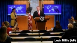 U.S. -- U.S. Secretary of State Mike Pompeo takes questions from reporters, seen observing social distancing, during a news conference at the State Department in Washington, April 7, 2020