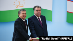 Tajik & Uzbek presidents push a symbolic button