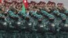 Azerbaijani soldiers march in formation on December 10 during a military parade marking the end of the Nagorno-Karabakh military conflict. 