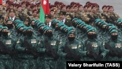 Azerbaijani soldiers march in formation on December 10 during a military parade marking the end of the Nagorno-Karabakh military conflict. 