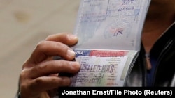 A member of the Al Murisi family, Yemeni nationals who were denied entry into the U.S. in April, after a previous travel ban.