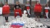 Protesters in Kyiv hold posters by artist Andriy Yermolenko during a rally demanding a boycott of the 2018 FIFA World Cup, which is being hosted by Russia, and the release of political prisoners held by Moscow. 