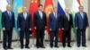 Given China's burgeoning presence in Uzbekistan, Uzbek President Islam Karimov (first from left) and his Chinese counterpart Xi JInping (third from left) probably had plenty to talk about on the sidelines of this week's Shanghai Cooperation Organization summit of regional leaders. 