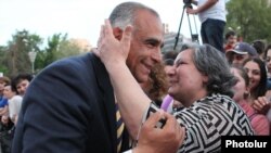 Armenia - Opposition leader Raffi Hovannisian is embraced by a supporter during an election campaign event in Yerevan, 1May2012.