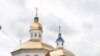 Петербург: на фотографа завели дело из-за поцелуя с партнером на фоне храма