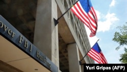 American flags fly outside of FBI headquarters in Washington, D.C.