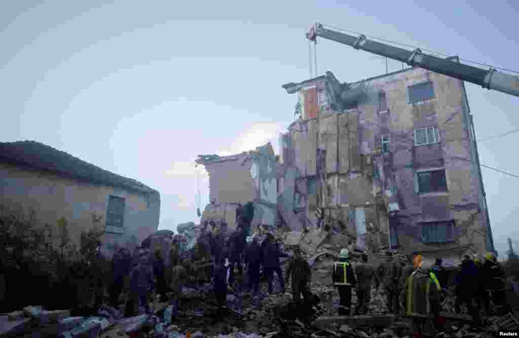 A collapsed building in Thumane.