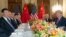 Chinese President Xi Jinping (left) and U.S. President Donald Trump, along with members of their delegations, hold a dinner meeting at the end of the G20 summit in Buenos Aires on December 1.