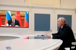 Fotografie din timpul convorbirii Vladimir Putin - Xi Jinping, 30 decembrie 2022.