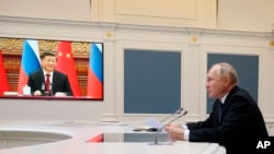 Presidenti i Rusisë, Vladimir Putin, gjatë një takimi virtual me presidentin e Kinës, Xi Jingping, 30 dhjetor 2022.