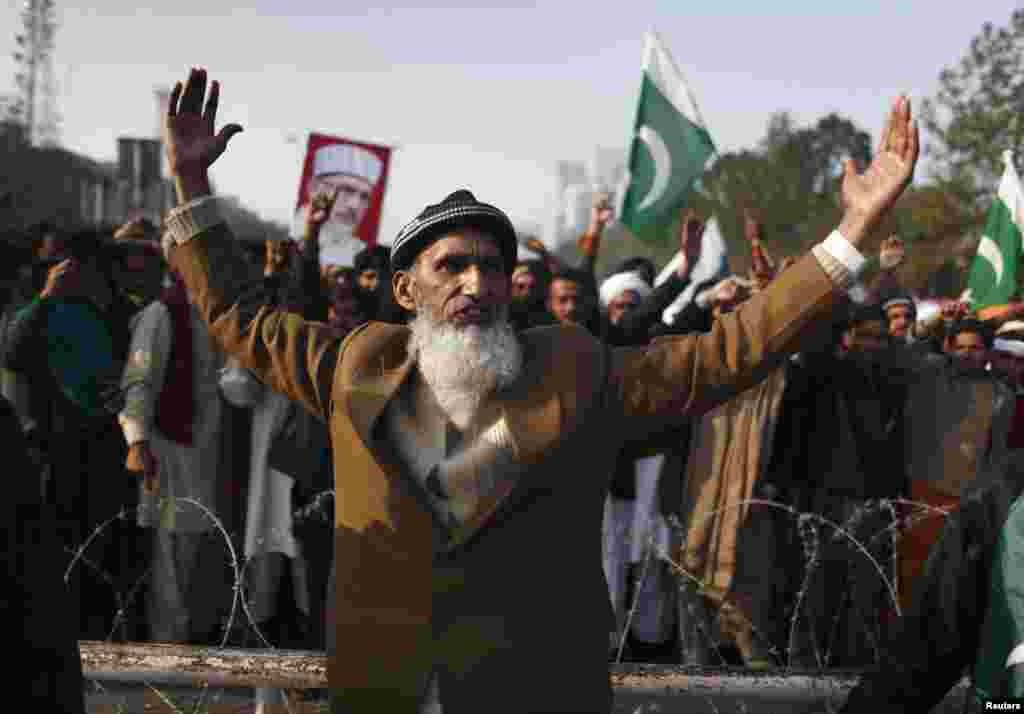 A supporter takes part in a rally in Islambad before the main group of marchers arrives. 