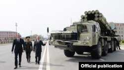 Azerbaijan - President Ilham Aliyev (L) inspects a Russian-made Smerch multiple-launch rocket system deployed in Nakhichevan, 7Apr2014.